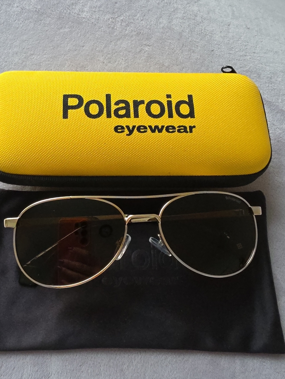 Polaroid Gold Frame Sunglasses with Yellow Case